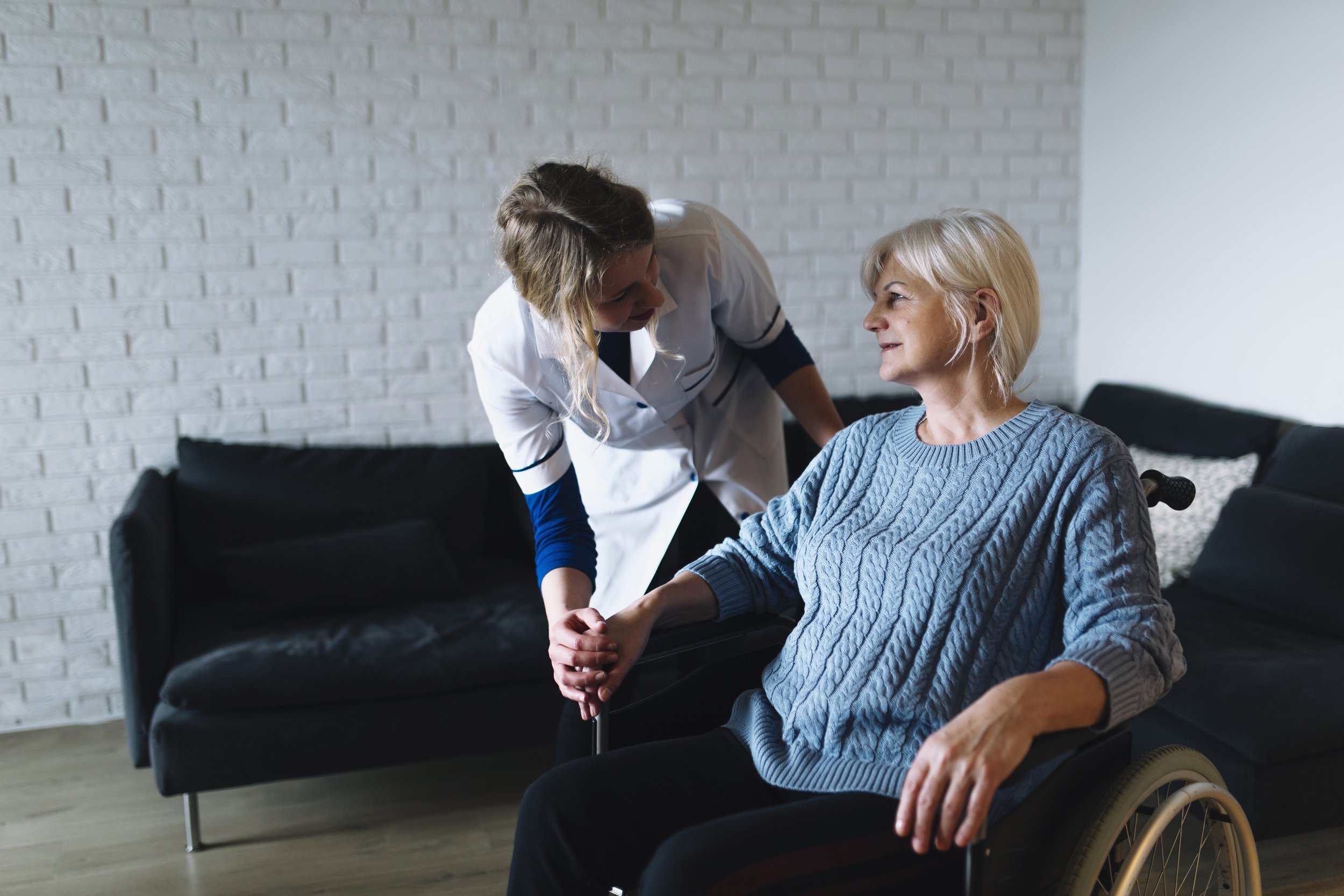 A support professional speaking with a client at home
